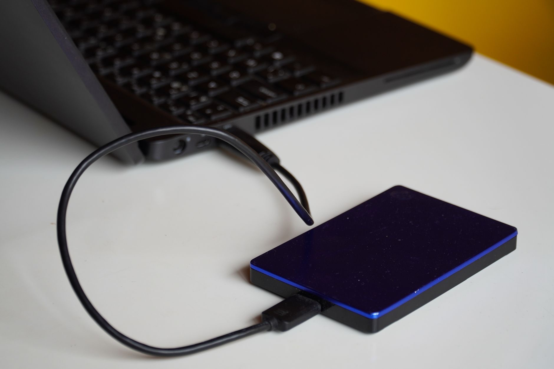 A laptop with an external drive