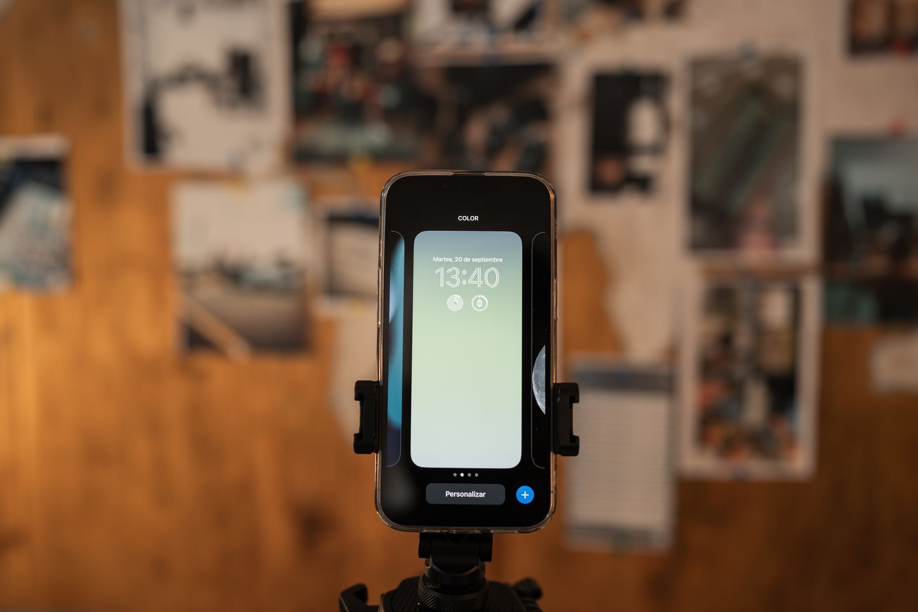 An iPhone positioned on a small tripod