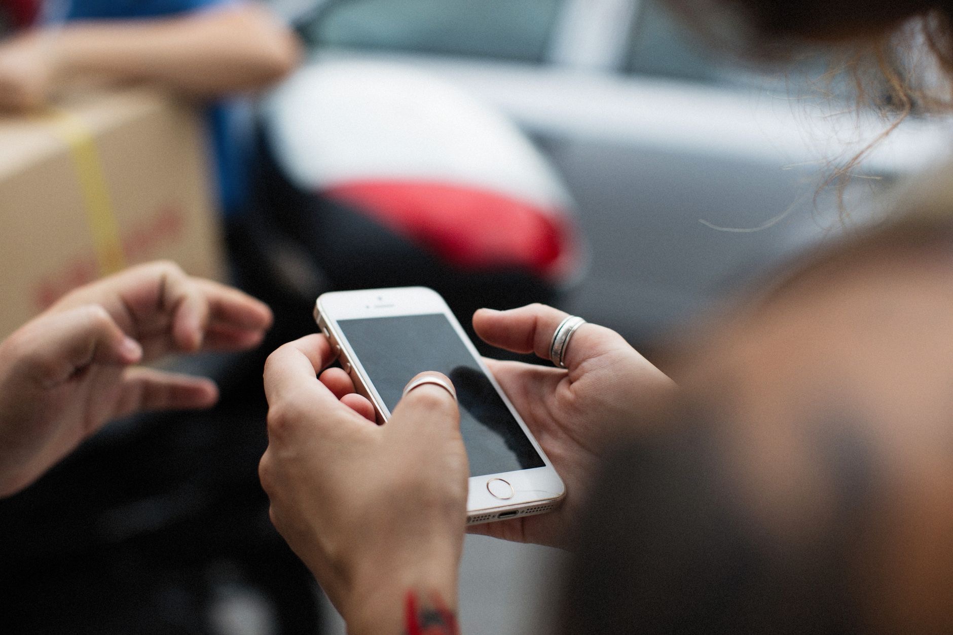Person using an iPhone with an accessory