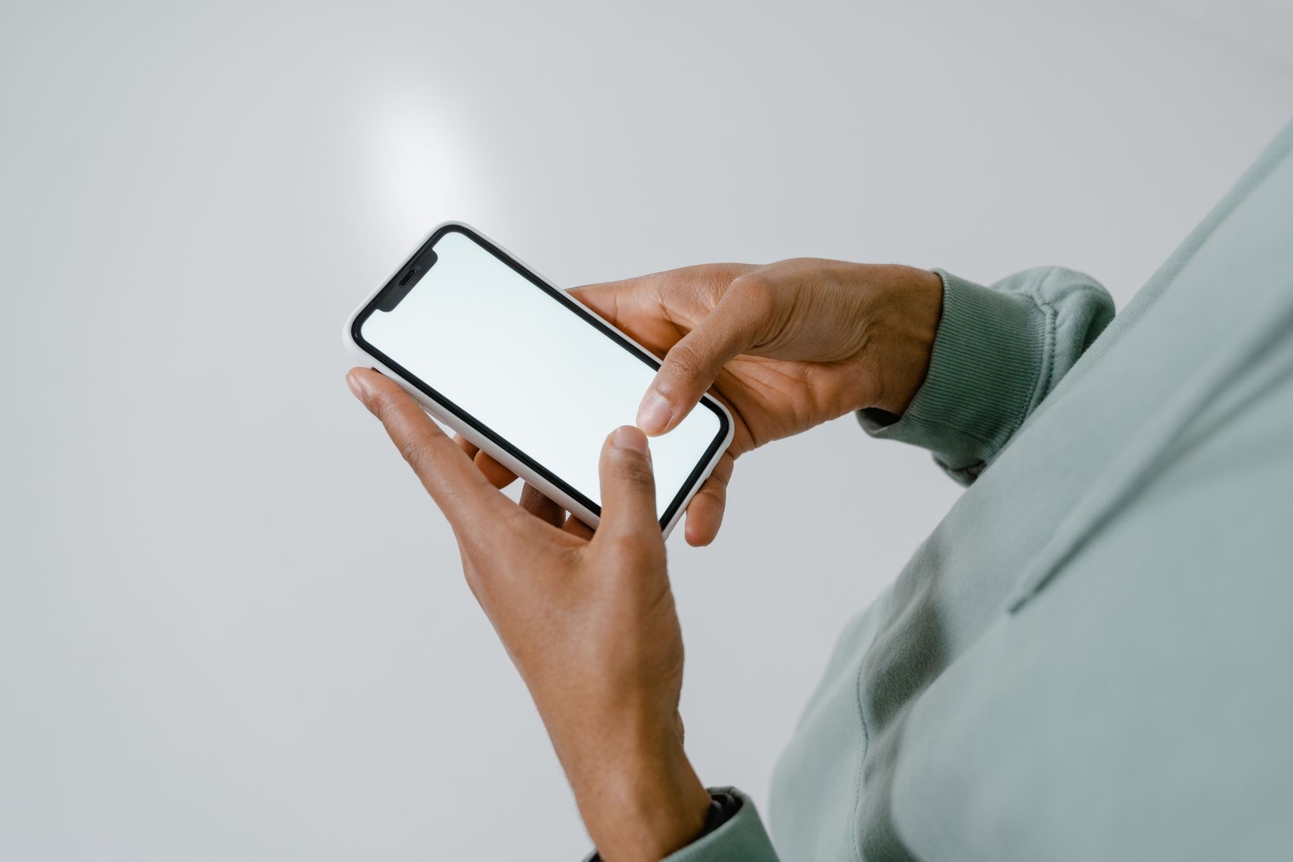 Person looking closely at an iPhone screen