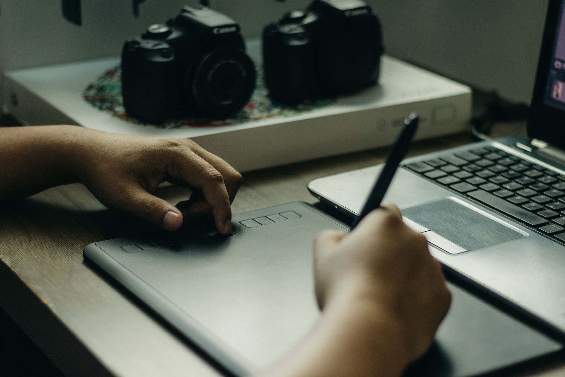 Person using a tablet for creative work