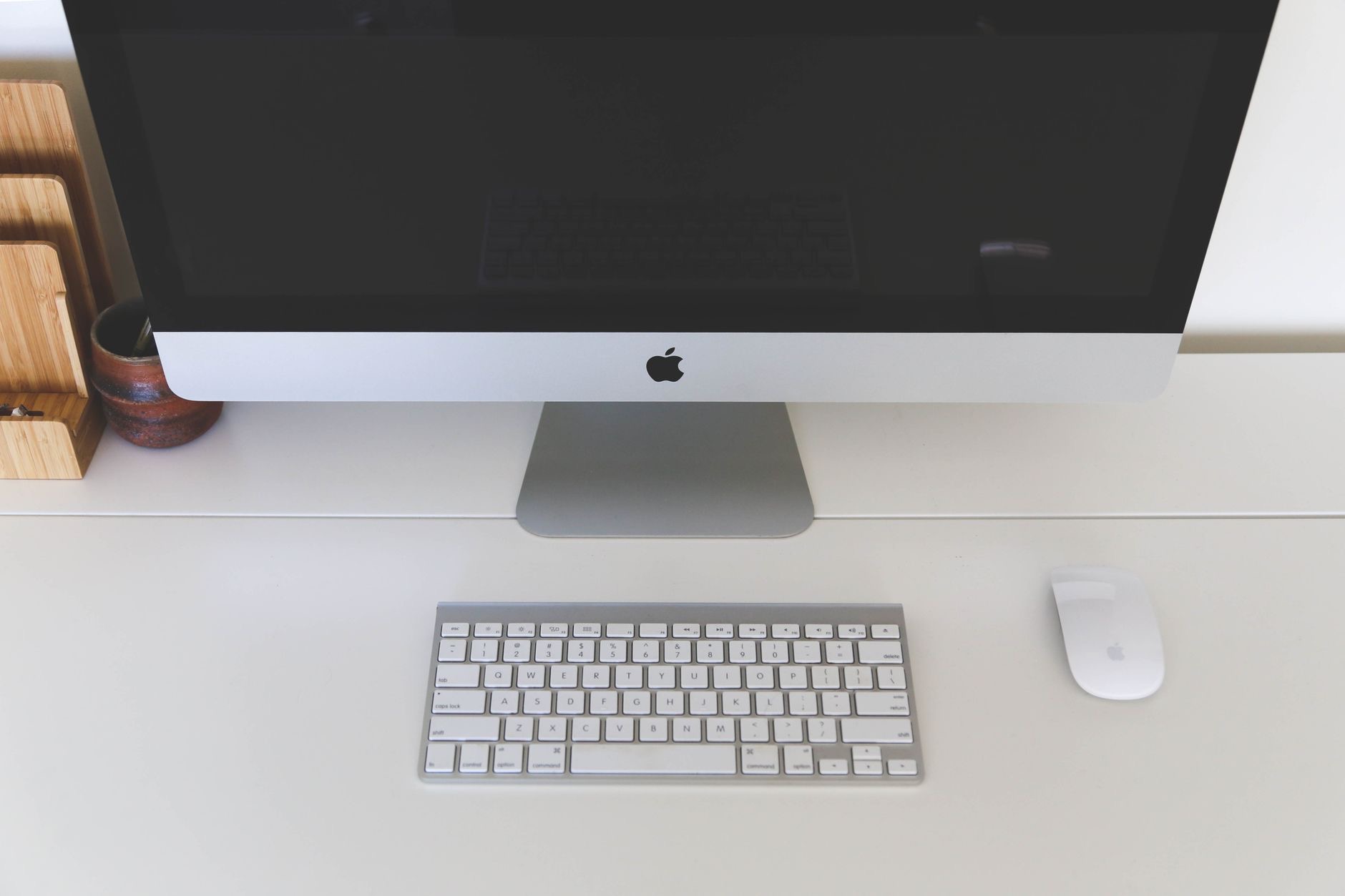 A tidy Mac desk with a keyboard