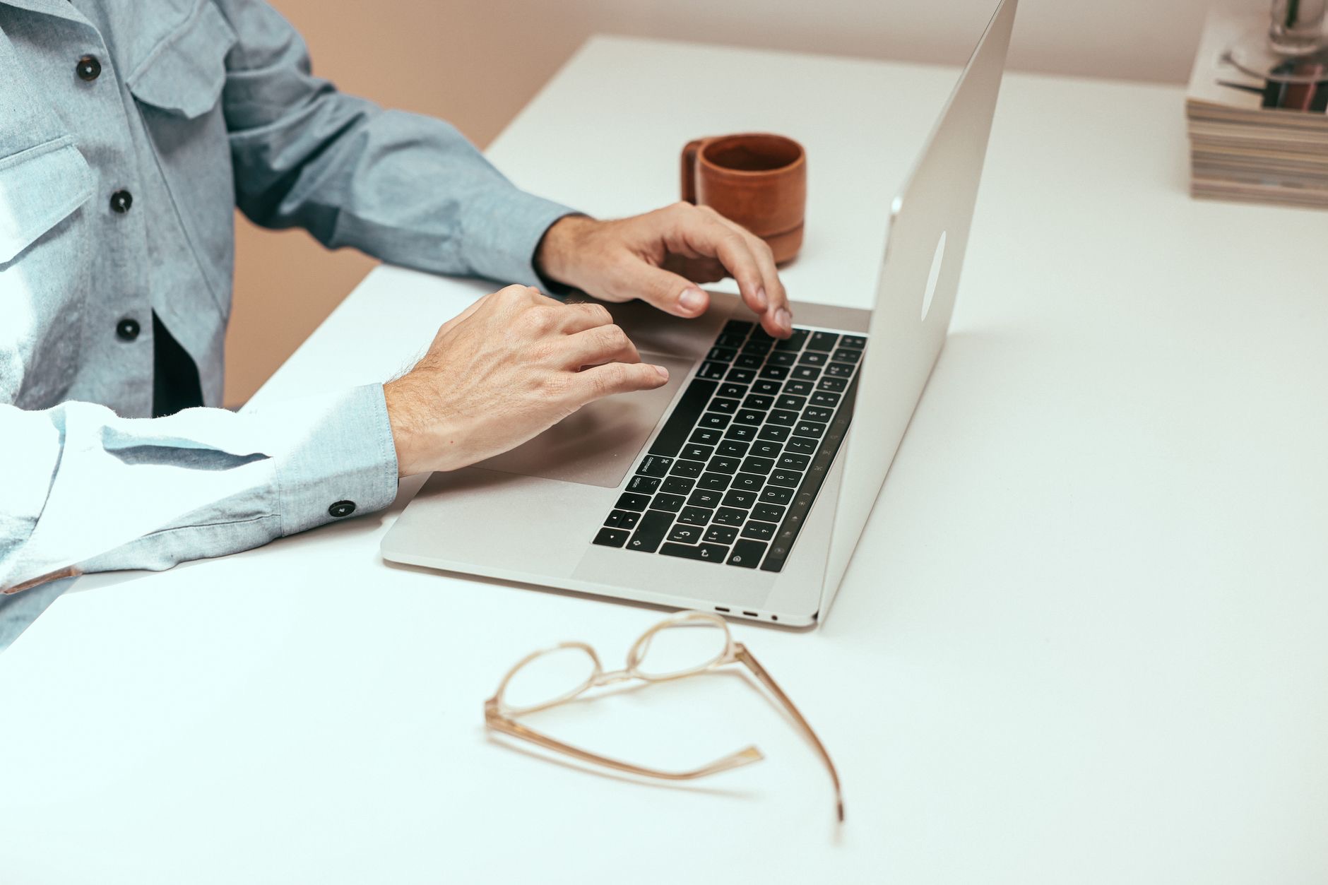 Person using a thin laptop