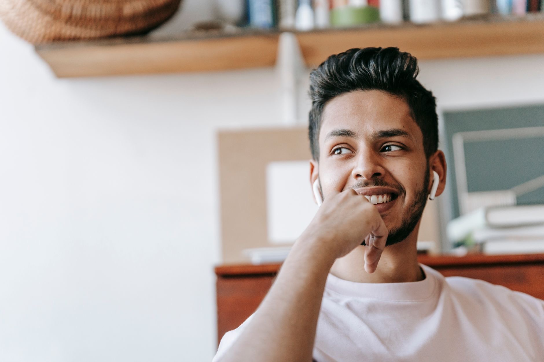 Person enjoying music with AirPods