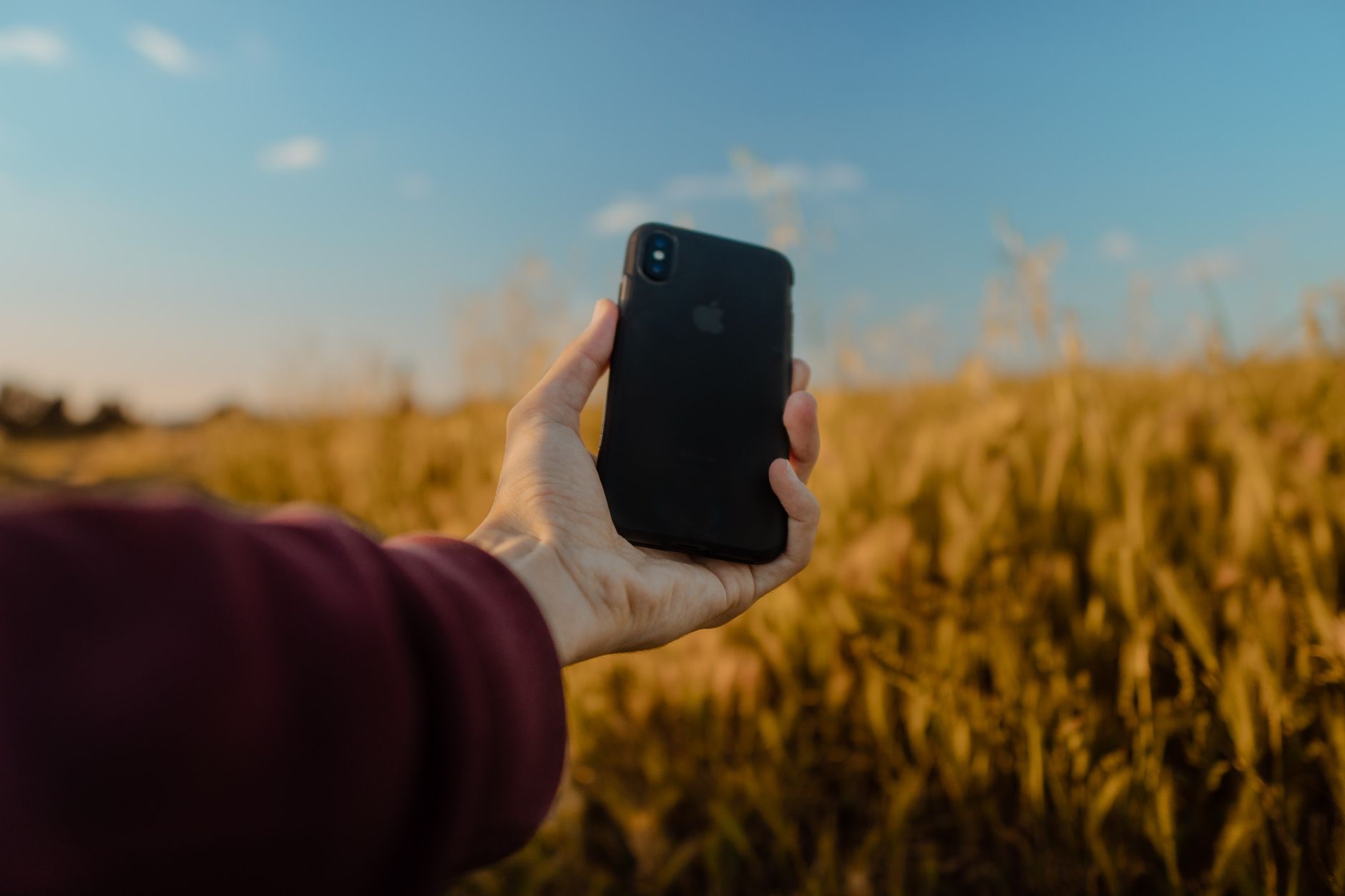 Person using an iPhone with accessories