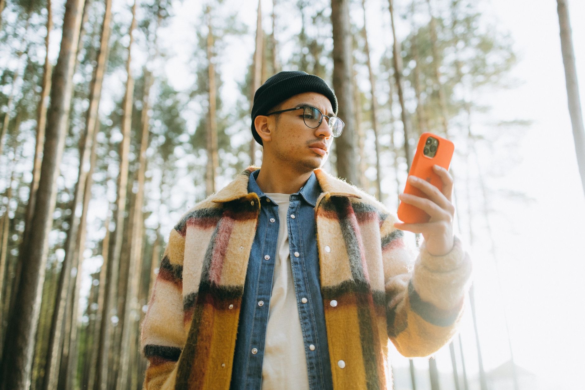 A person checking iPhone signal outdoors