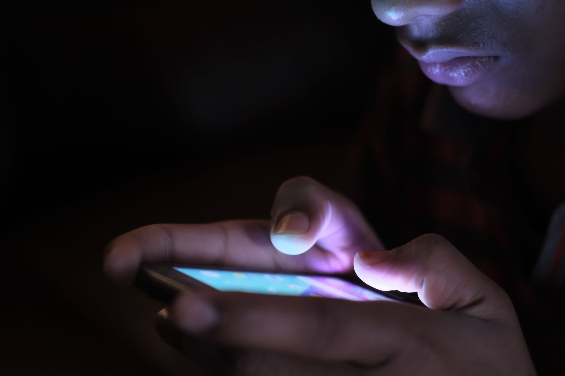 Person using a phone at night