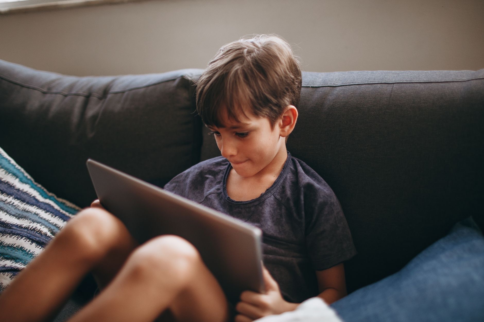 A child using an older tablet