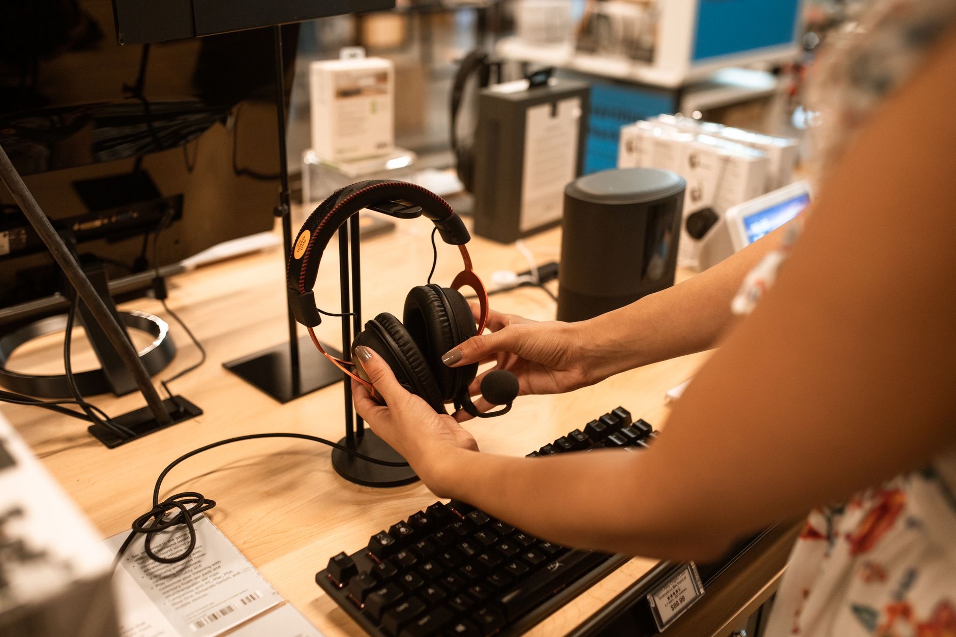 Person choosing between earbuds